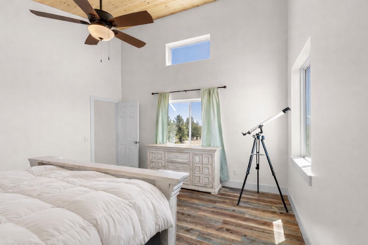 431 Rudisill Street Fairplay, CO 80440 - Photo 24 of 45 a bedroom with a bed and a wooden floor