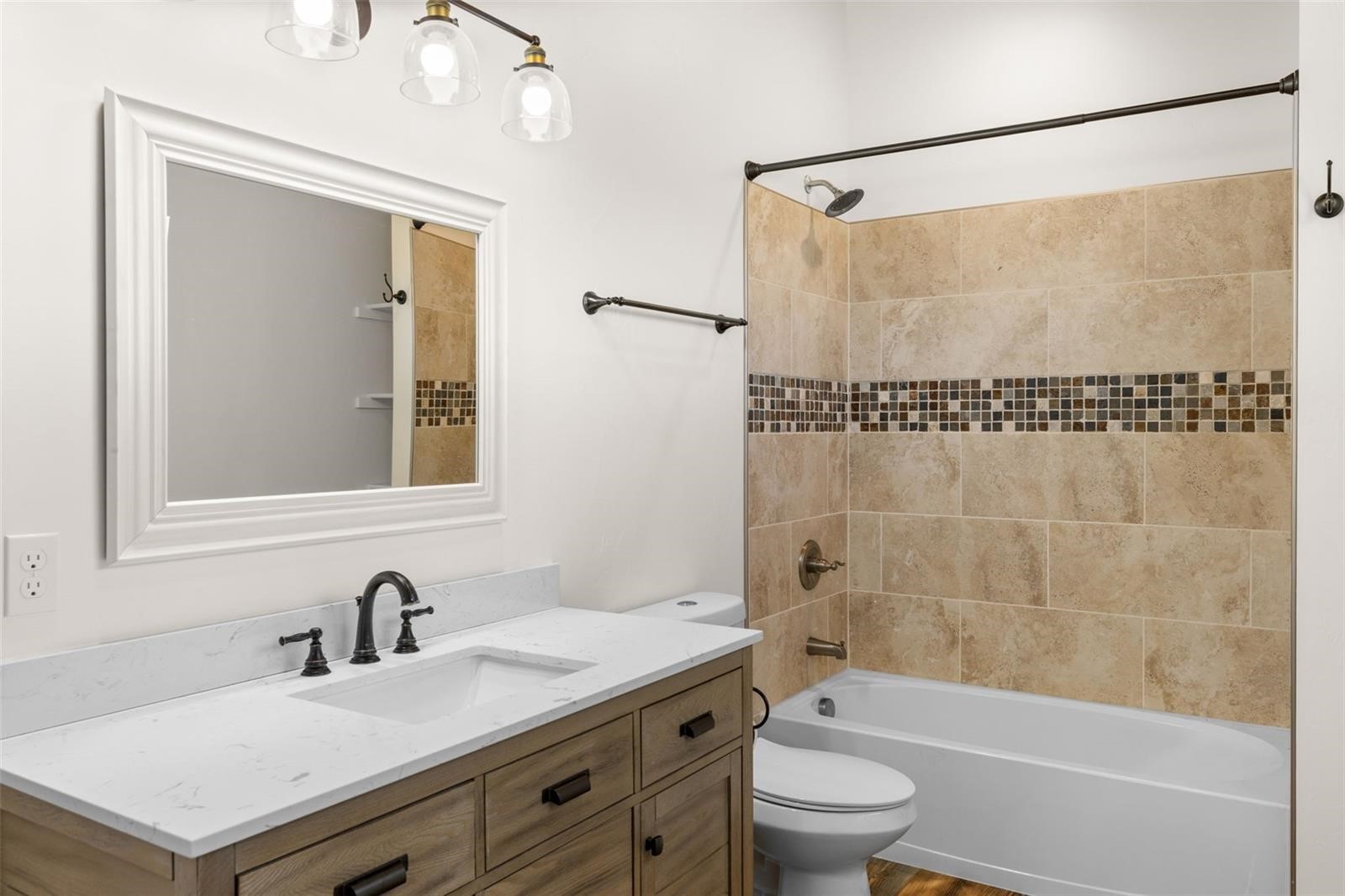 431 Rudisill Street Fairplay, CO 80440 - Photo 27 of 45 a bathroom with a granite countertop sink a toilet and shower