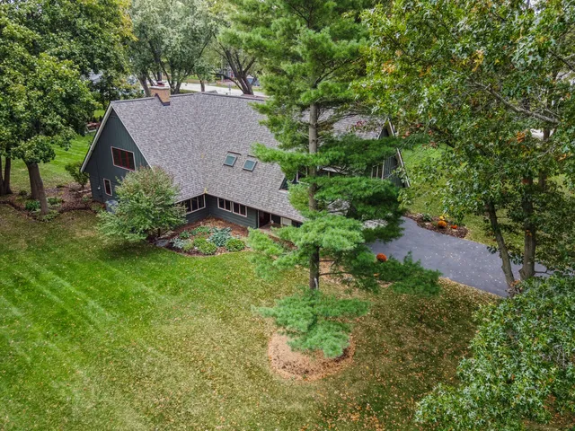 an aerial view of a house with a yard