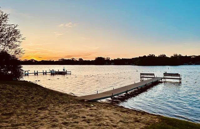 a view of a lake with houses in the background