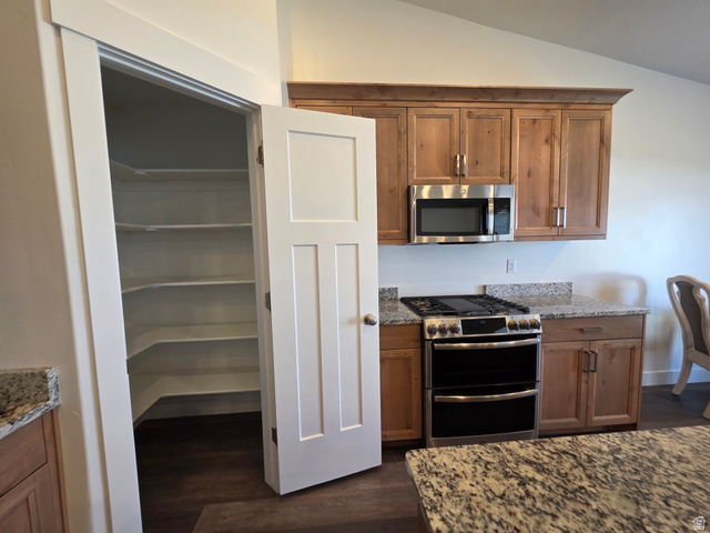 1237 West 3440 South Logan, UT 84321 - Photo 12 of 29 Kitchen pantry featuring multiple shelves and a three-panel interior door