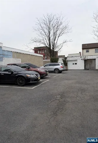 a view of street with parked cars
