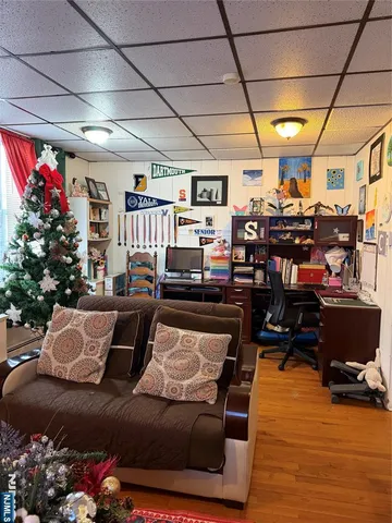 a living room with lots of furniture and a chandelier