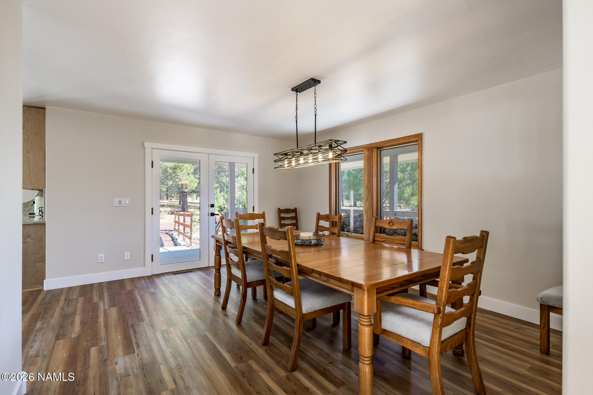 4540 Forest Ranches Loop Parks, AZ 86018 - Photo 12 of 60 a dining room with furniture window wooden floor