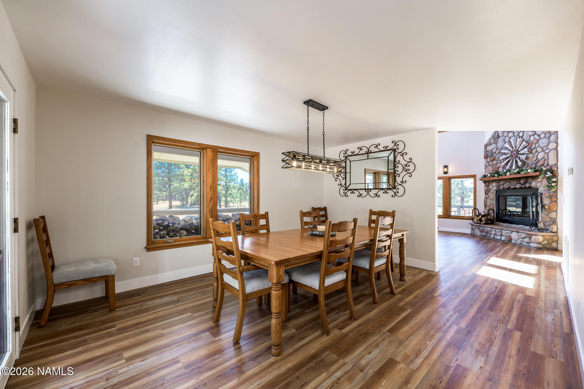 4540 Forest Ranches Loop Parks, AZ 86018 - Photo 13 of 60 a view of a dining room with furniture window and wooden floor
