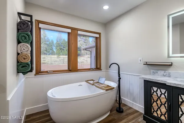 a white toilet sitting next to a shower