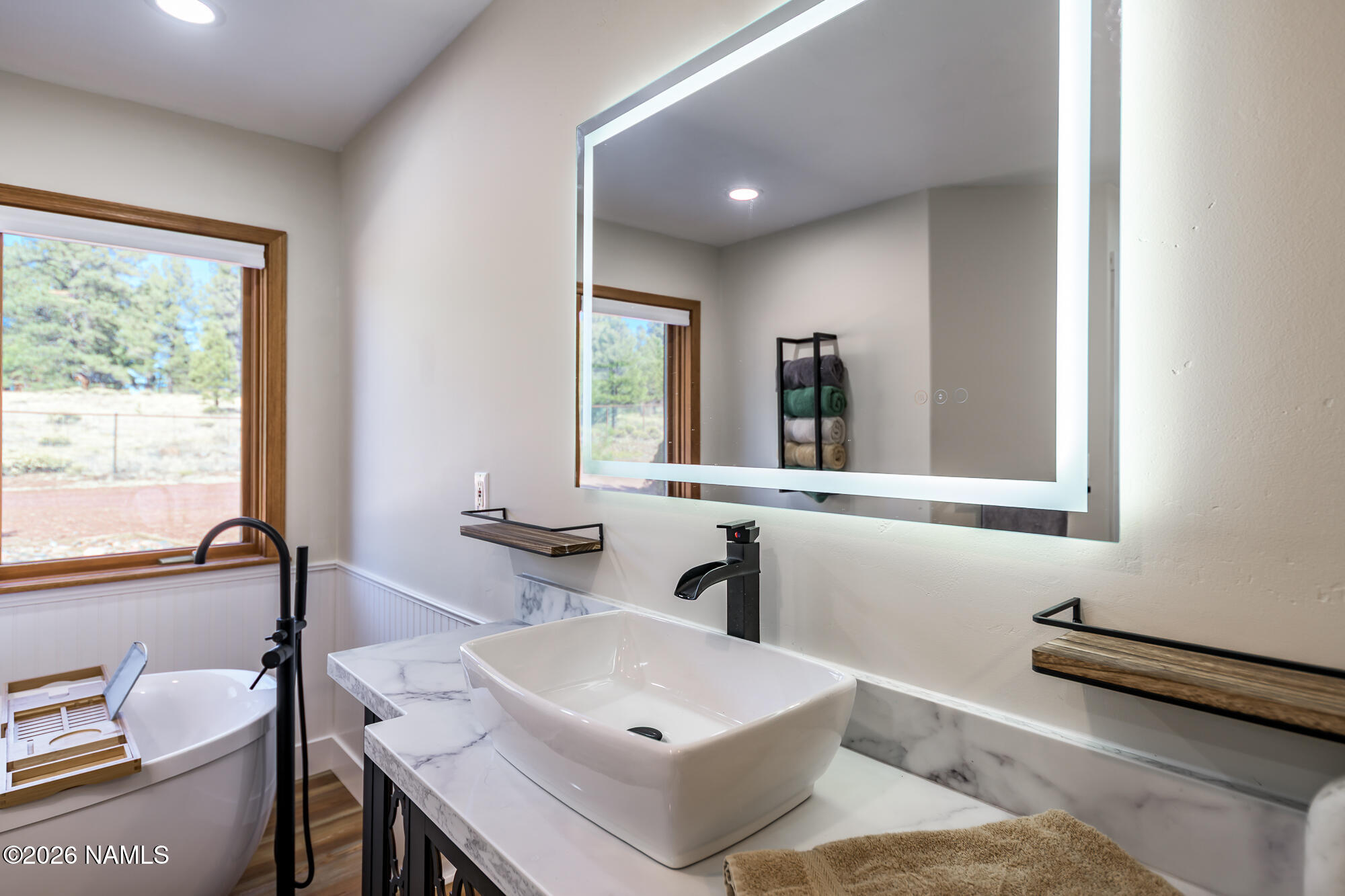 4540 Forest Ranches Loop Parks, AZ 86018 - Photo 17 of 60 a bathroom with a sink and a mirror