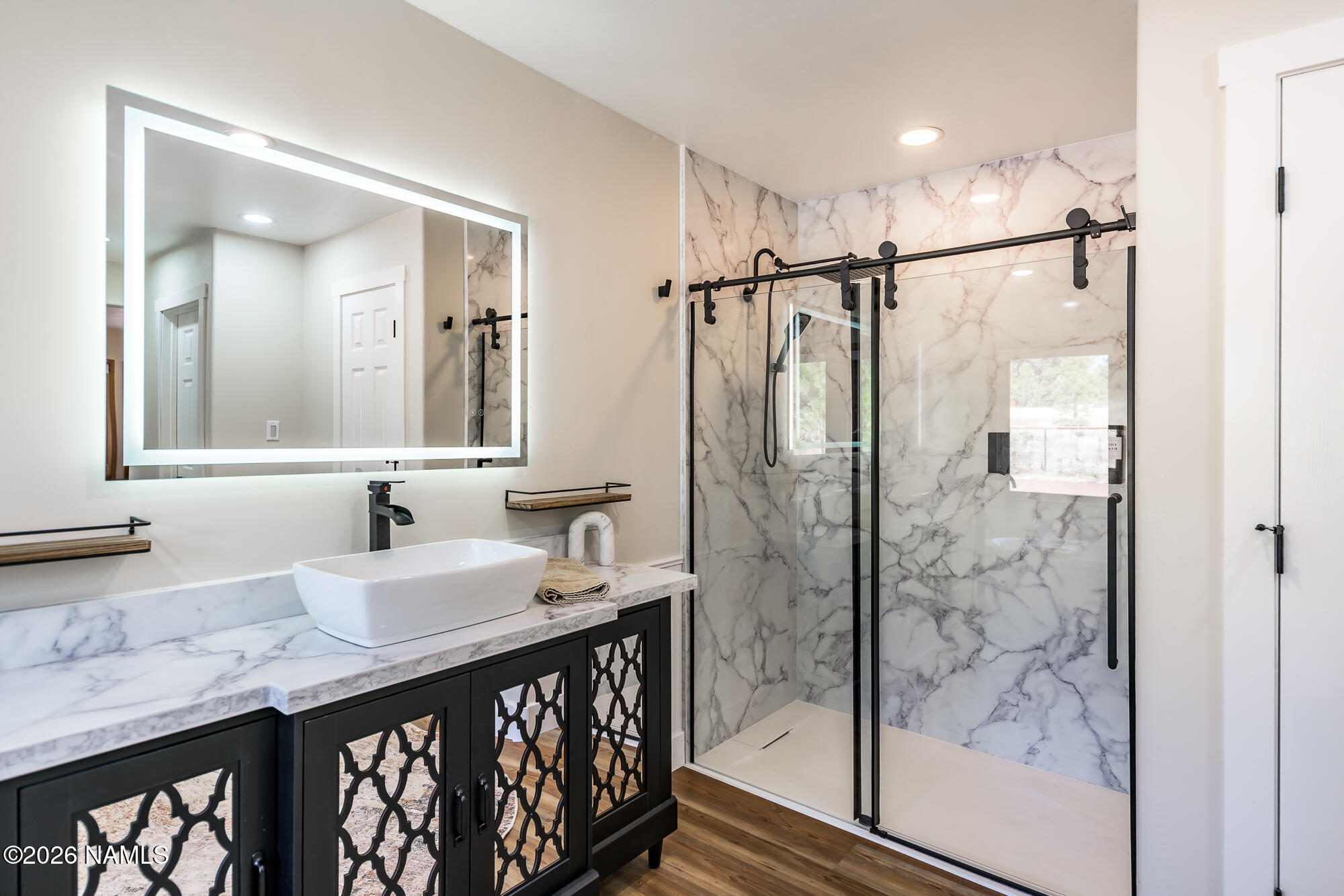 4540 Forest Ranches Loop Parks, AZ 86018 - Photo 18 of 60 a bathroom with a double vanity sink mirror and shower