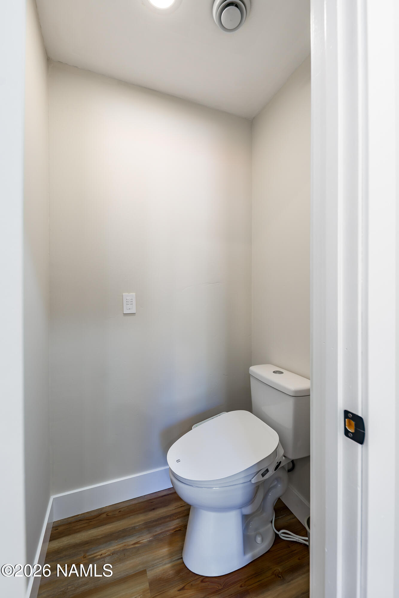4540 Forest Ranches Loop Parks, AZ 86018 - Photo 19 of 60 a white toilet sitting next to a shower