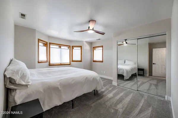 a view of a livingroom with furniture and a window
