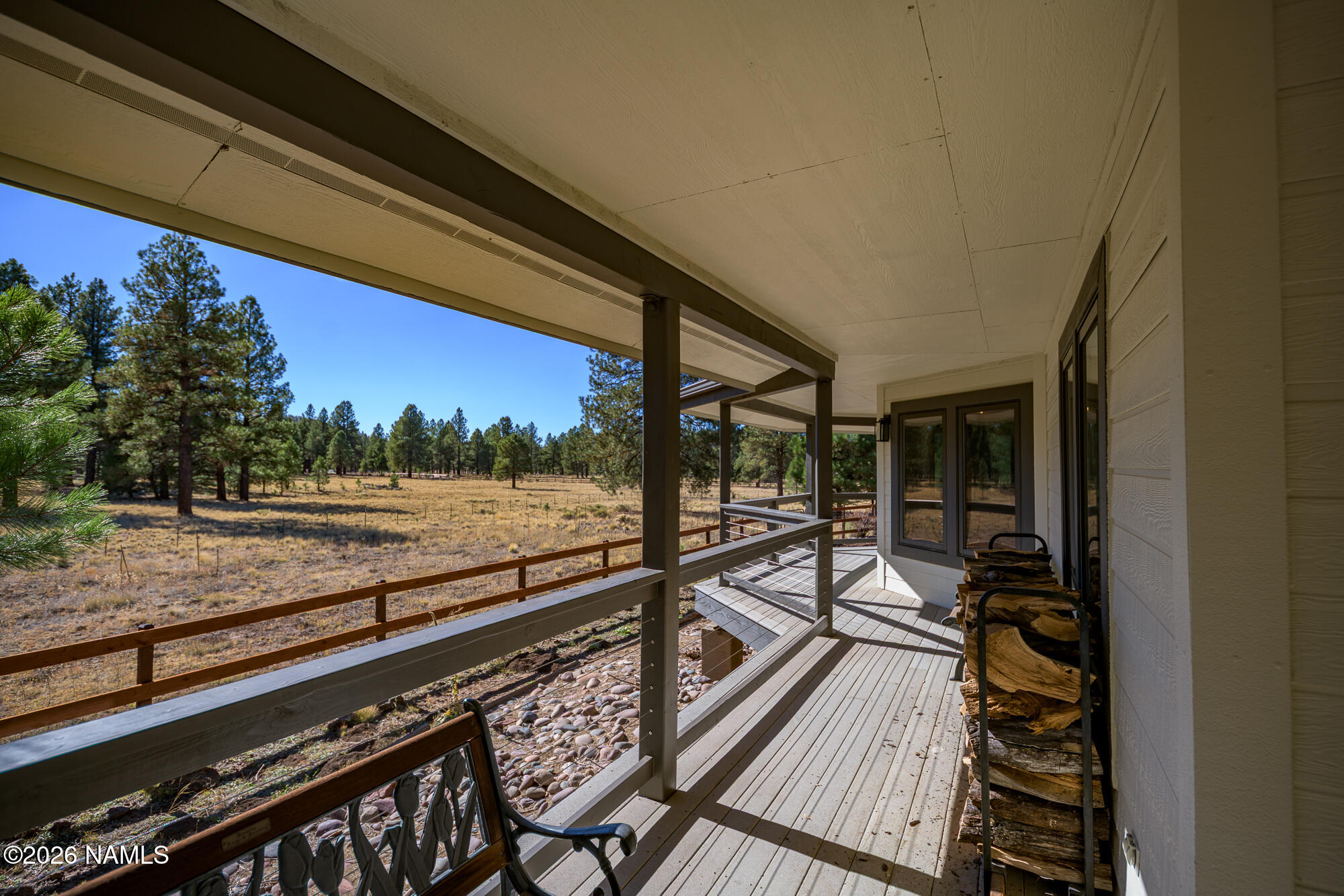 4540 Forest Ranches Loop Parks, AZ 86018 - Photo 32 of 60 a view of a balcony with chairs and a potted plant