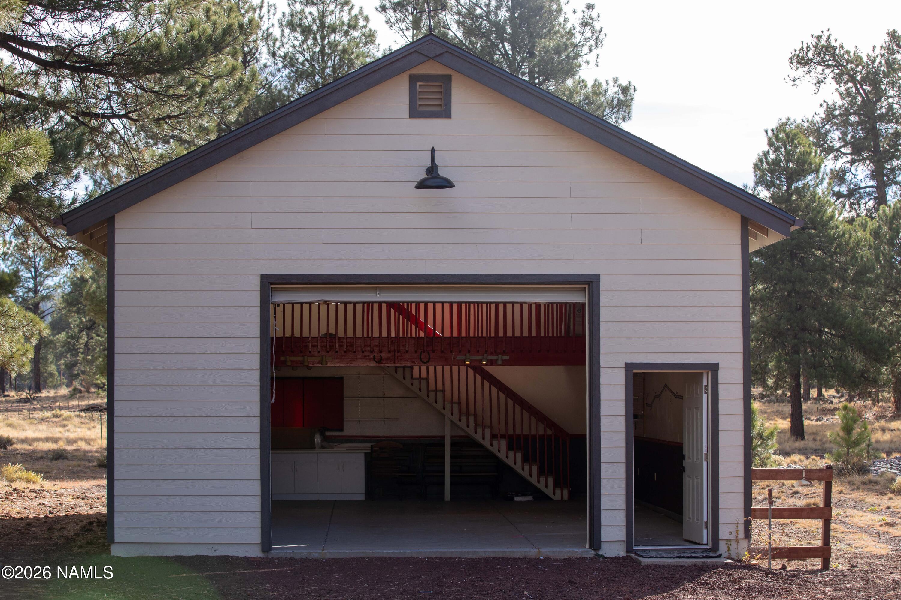 4540 Forest Ranches Loop Parks, AZ 86018 - Photo 38 of 60 a front view of a house with garage