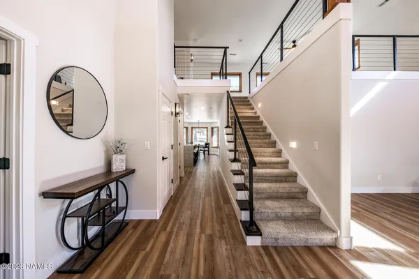 a kitchen with stainless steel appliances granite countertop sink stove top oven and cabinets