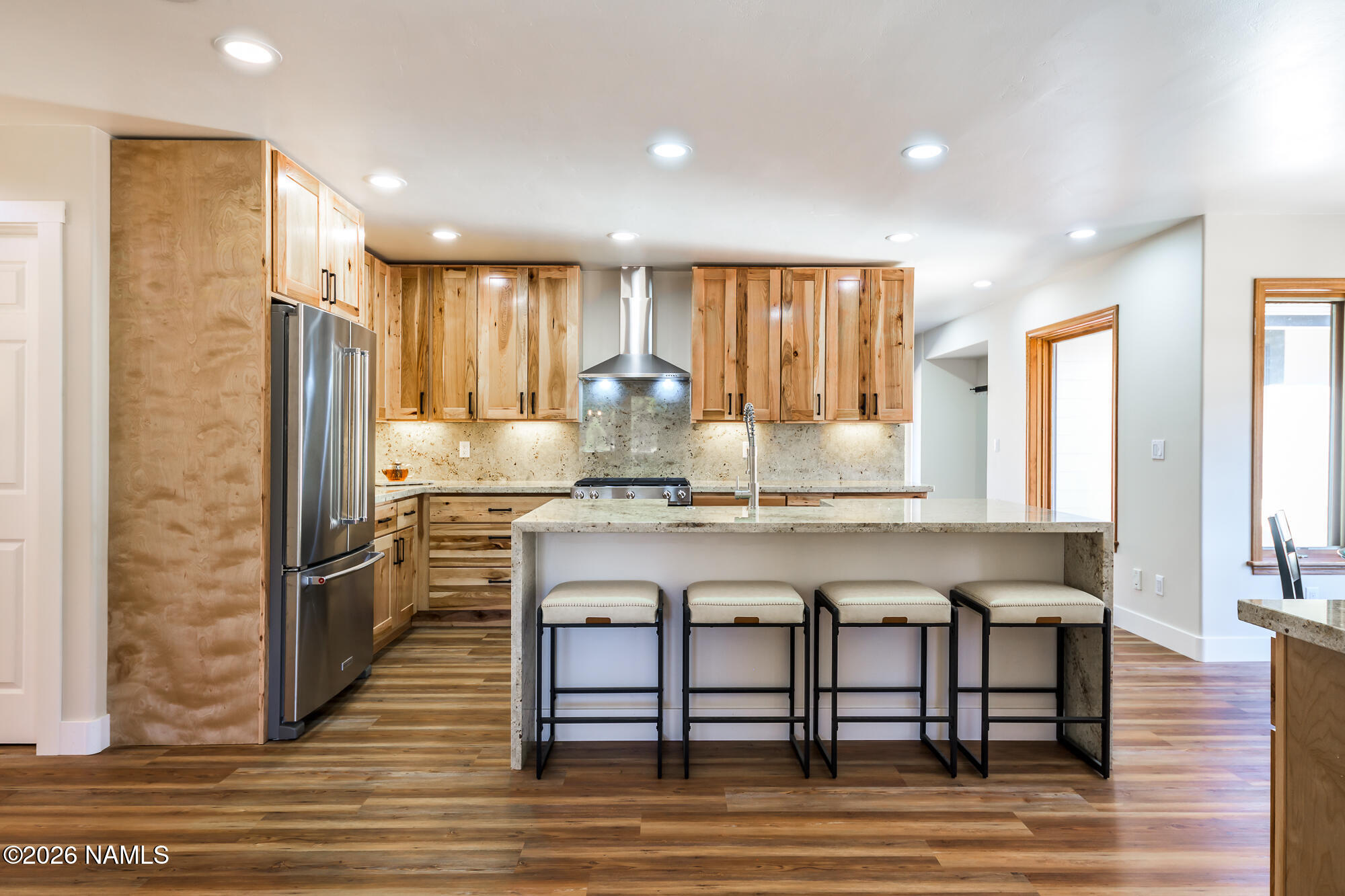 4540 Forest Ranches Loop Parks, AZ 86018 - Photo 6 of 60 a kitchen with stainless steel appliances granite countertop a kitchen island hardwood floor sink stove and granite counter top