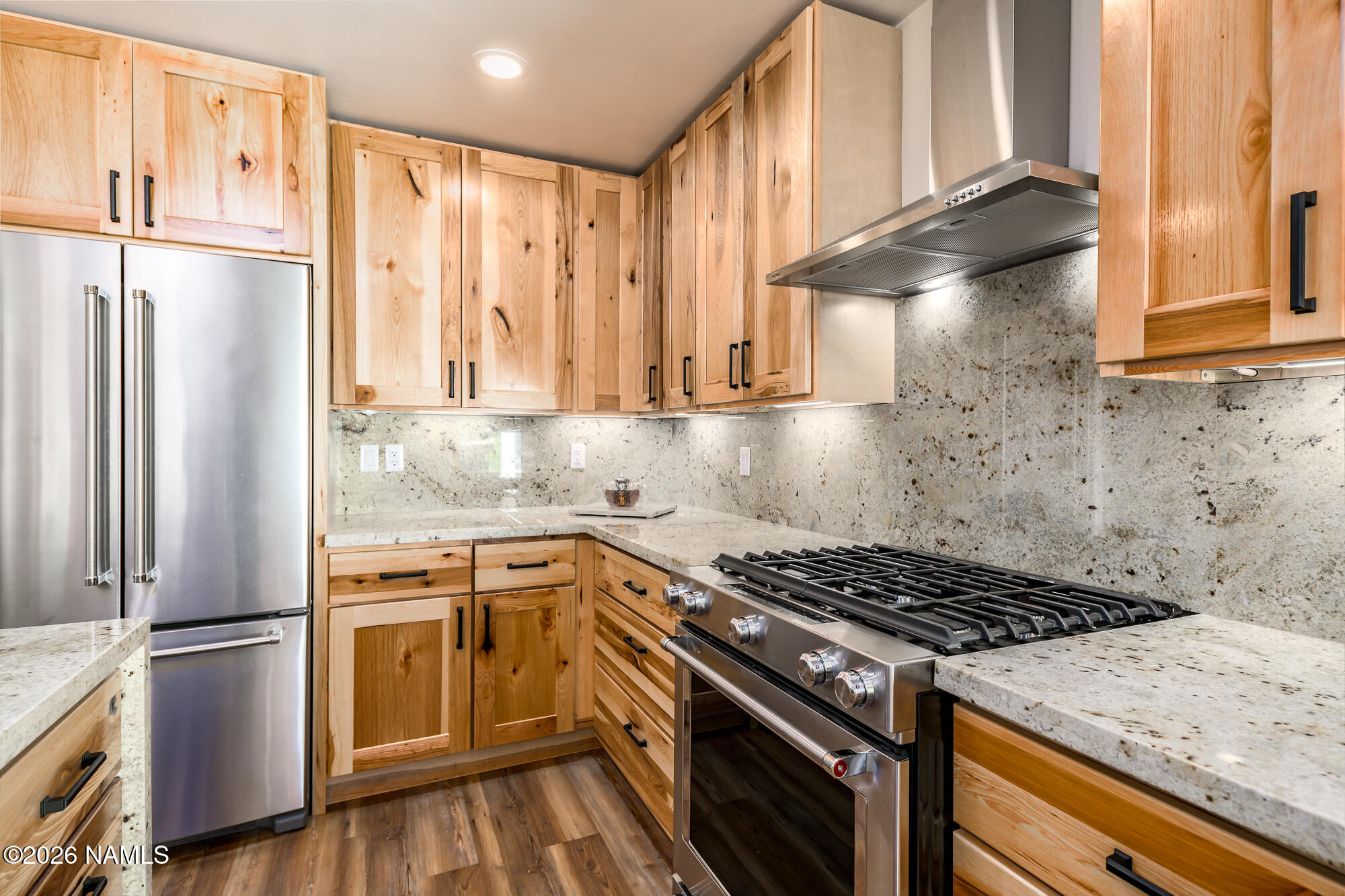 4540 Forest Ranches Loop Parks, AZ 86018 - Photo 10 of 60 a kitchen with a stove a refrigerator and a window