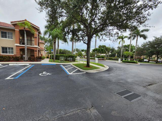 3810 North Jog Road, Unit 202 West Palm Beach, FL 33411 - Photo 2 of 23 SECURITY GATE ENTRANCE V2