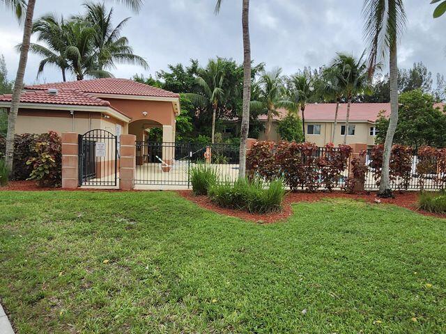 3810 North Jog Road, Unit 202 West Palm Beach, FL 33411 - Photo 23 of 23 ENTRANCE TO THE POOL AREA