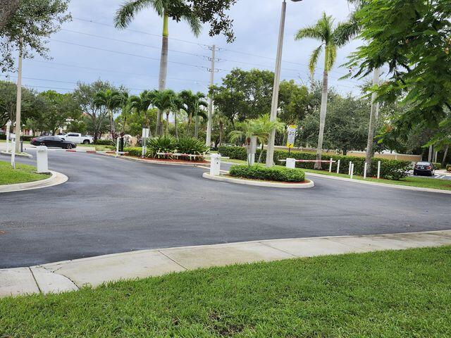 3810 North Jog Road, Unit 202 West Palm Beach, FL 33411 - Photo 3 of 23 SECURITY GATE
