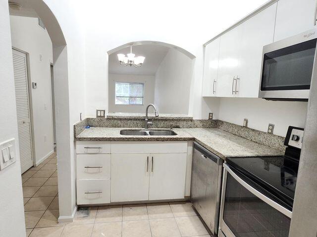 3810 North Jog Road, Unit 202 West Palm Beach, FL 33411 - Photo 9 of 23 KITCHEN VIEW 2