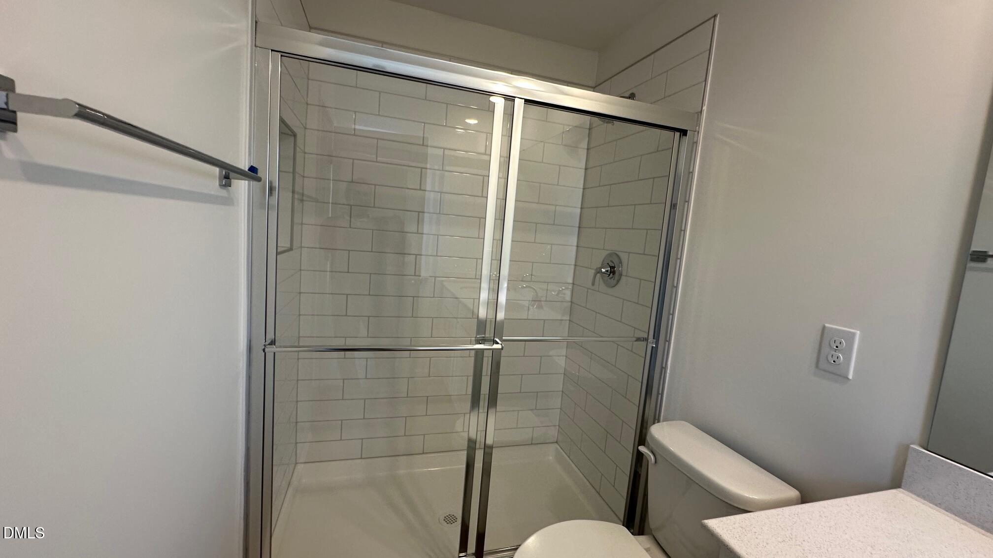 10610 Brookside Reserve Road Raleigh, NC 27614 - Photo 12 of 27 a bathroom with a toilet and a shower