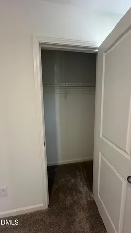 a white toilet and tub sitting next to a bathroom sink