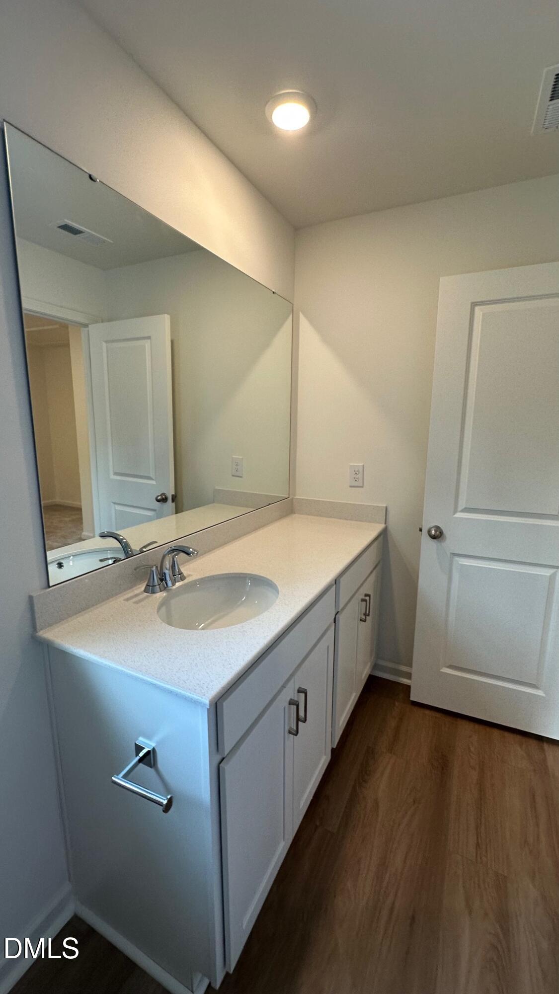 10610 Brookside Reserve Road Raleigh, NC 27614 - Photo 22 of 27 a bathroom with a double vanity sink and mirror