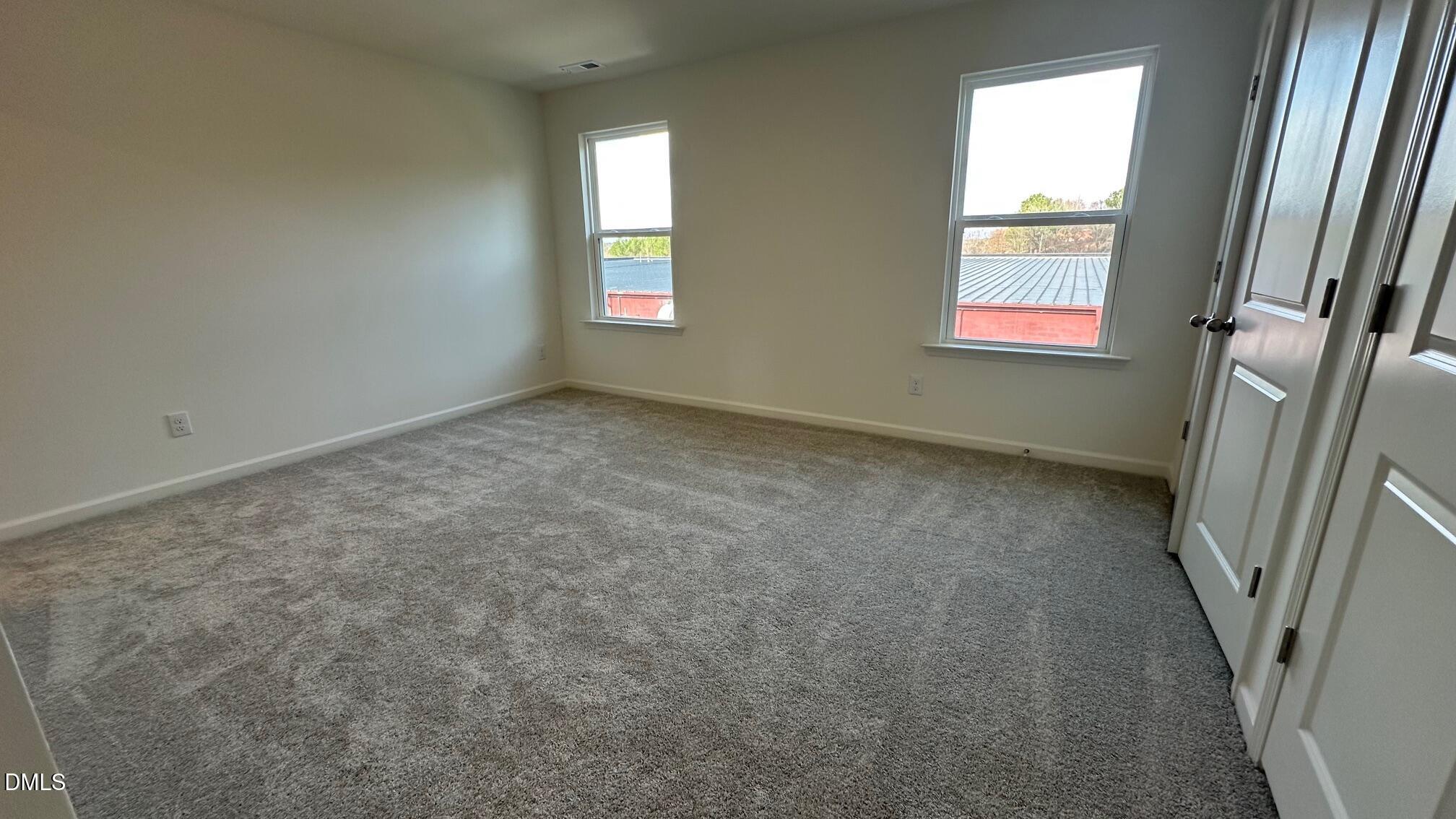 10610 Brookside Reserve Road Raleigh, NC 27614 - Photo 9 of 27 an empty room with windows