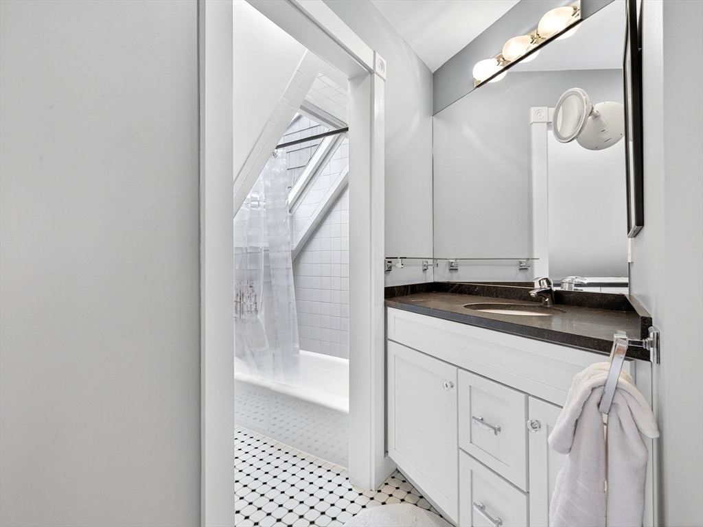 32 Donizetti Street Wellesley, MA 02482 - Photo 12 of 22 a bathroom with a sink and a mirror