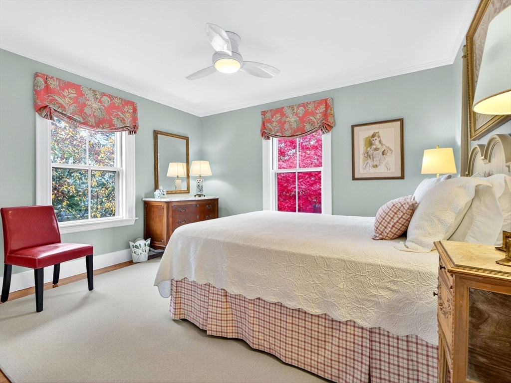 32 Donizetti Street Wellesley, MA 02482 - Photo 14 of 22 a bedroom with a bed and a couch