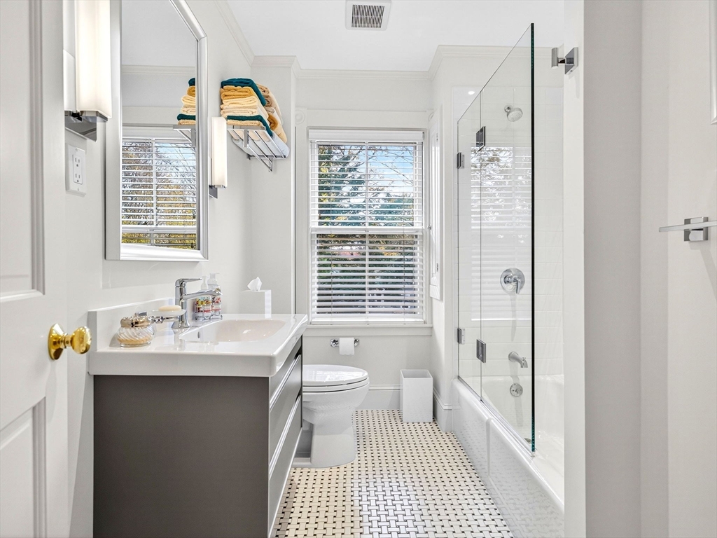 32 Donizetti Street Wellesley, MA 02482 - Photo 17 of 22 a bathroom with a sink a toilet and shower