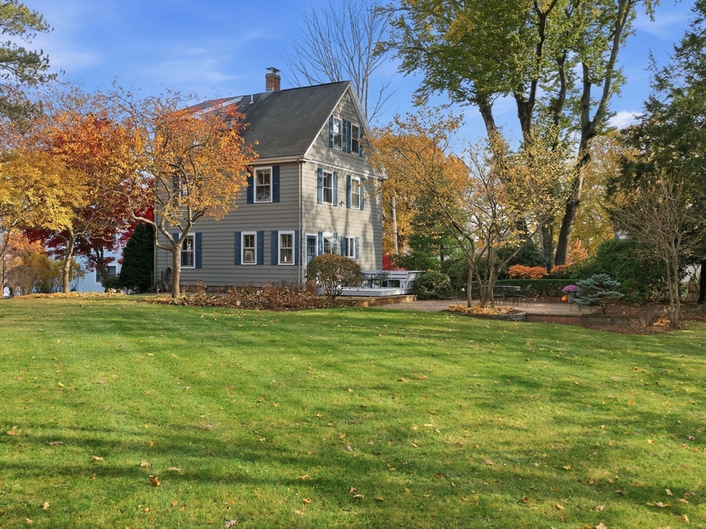 32 Donizetti Street Wellesley, MA 02482 - Photo 22 of 22 a front view of house with yard and trees