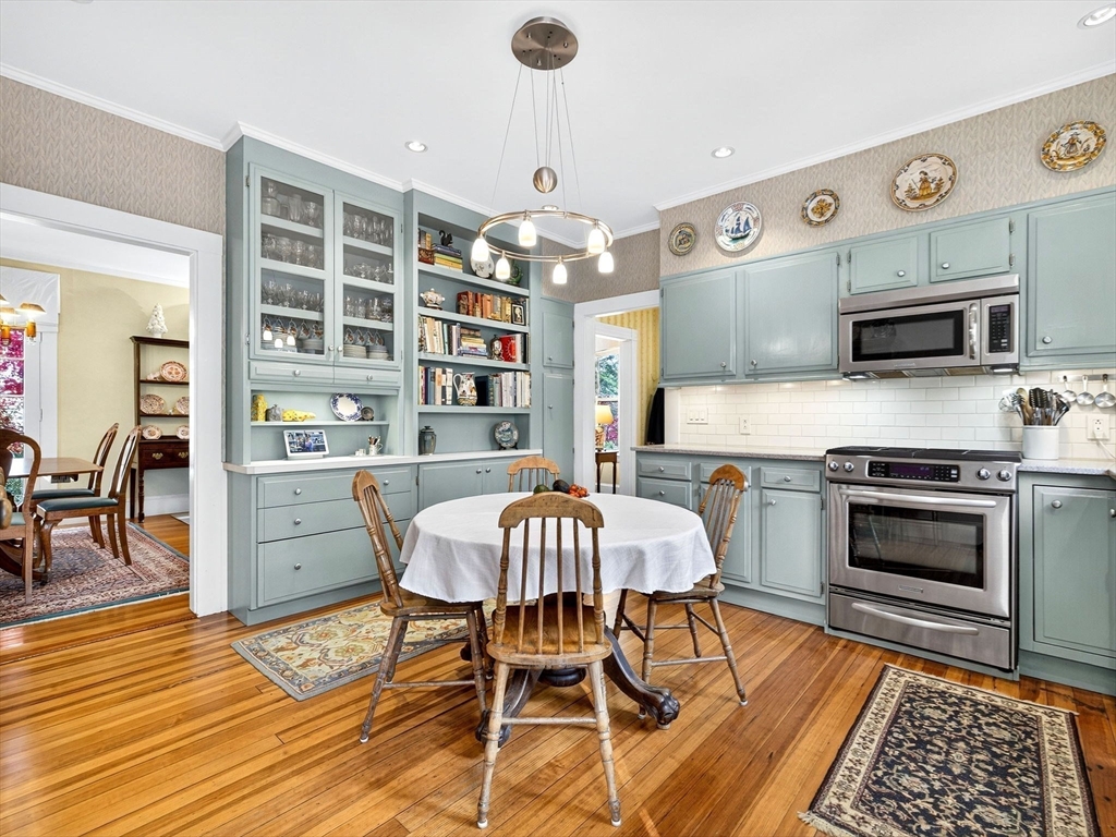 32 Donizetti Street Wellesley, MA 02482 - Photo 4 of 22 a view of a dining room with furniture a rug and wooden floor