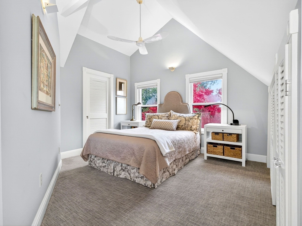 32 Donizetti Street Wellesley, MA 02482 - Photo 9 of 22 a bedroom with a bed and ceiling fan