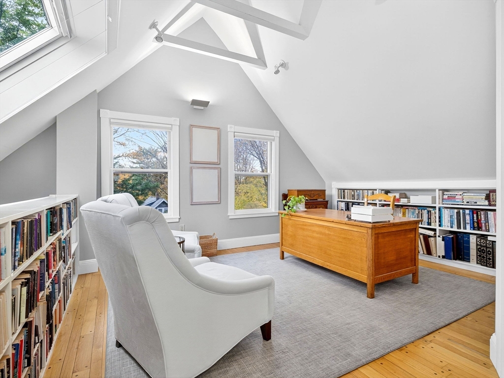 32 Donizetti Street Wellesley, MA 02482 - Photo 10 of 22 a living room with furniture and a book shelf