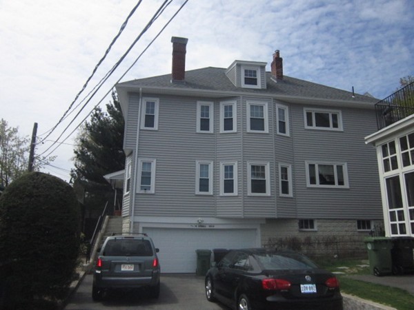 a car parked in front of a house