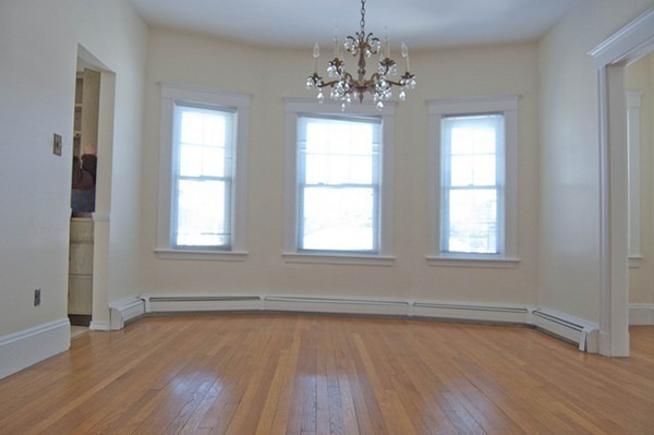 8-10 Kimball Road Watertown, MA 02472 - Photo 12 of 20 a view of empty room with wooden floor and fan