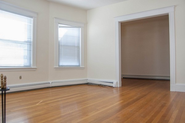 8-10 Kimball Road Watertown, MA 02472 - Photo 13 of 20 an empty room with wooden floor and windows