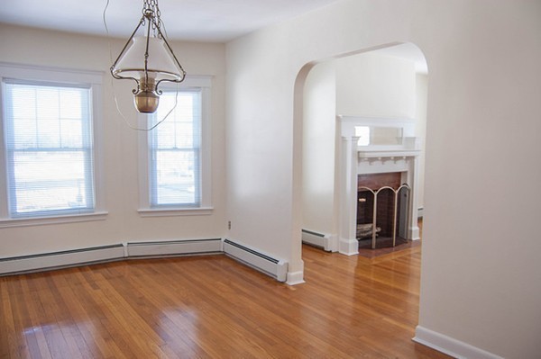 8-10 Kimball Road Watertown, MA 02472 - Photo 18 of 20 a view of empty room with wooden floor and fan