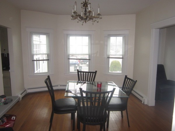 8-10 Kimball Road Watertown, MA 02472 - Photo 7 of 20 a view of a dining room with furniture window and outside view