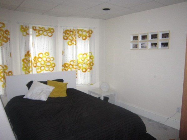 8-10 Kimball Road Watertown, MA 02472 - Photo 8 of 20 a bedroom with a bed and a window