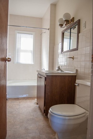 8-10 Kimball Road Watertown, MA 02472 - Photo 10 of 20 a bathroom with a sink a toilet and bathtub