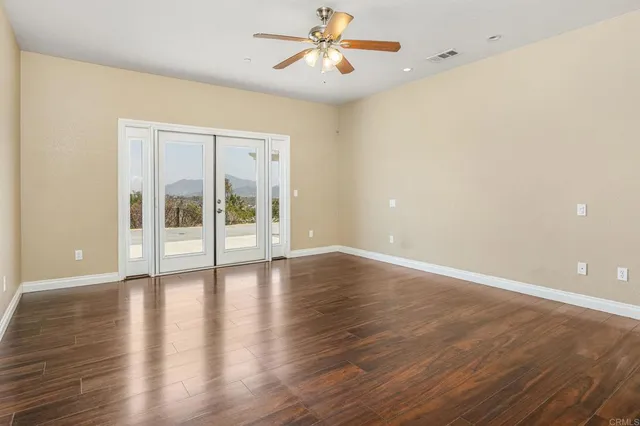 a view of a patio with a table and chairs