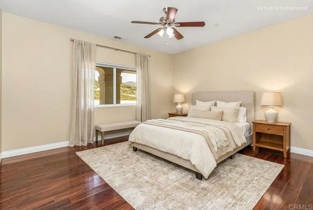 an aerial view of residential houses with outdoor space and trees