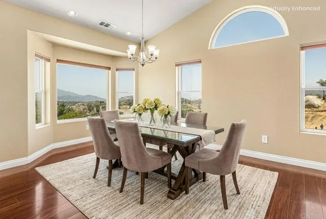 a view of kitchen and dining room with wooden floor
