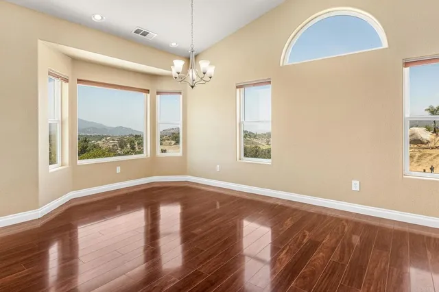 a kitchen with a sink a counter top space and stainless steel appliances