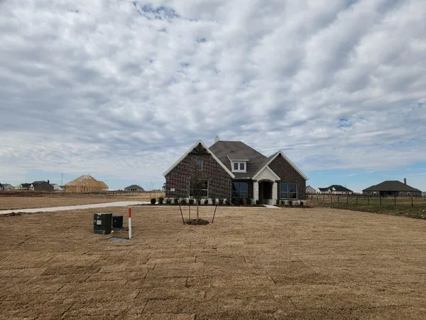 a view of house with outside space and lake view