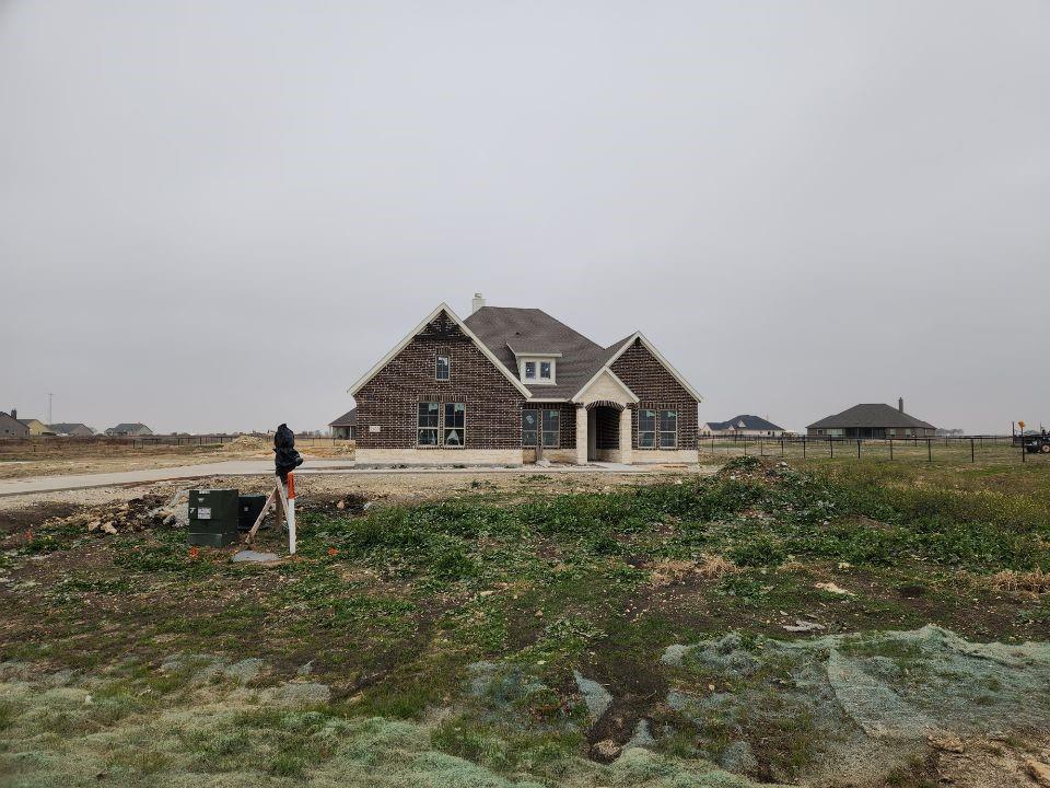 a house view with a garden space