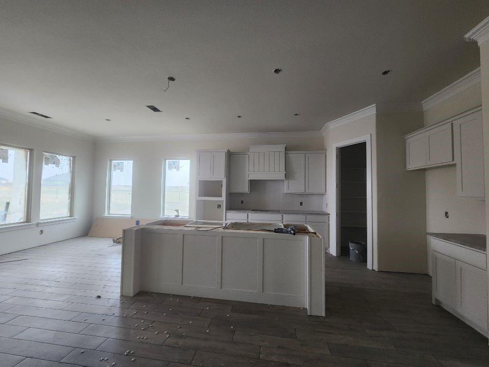 2433 Meteor Drive Krum, TX 76249 - Photo 6 of 12 a kitchen with stainless steel appliances granite countertop a sink and cabinets