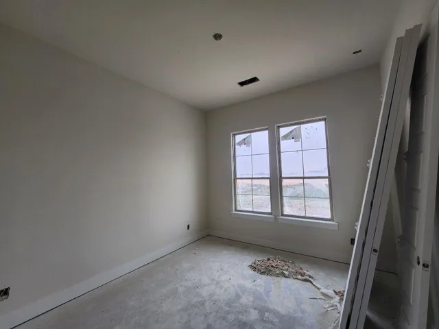 an empty room with windows