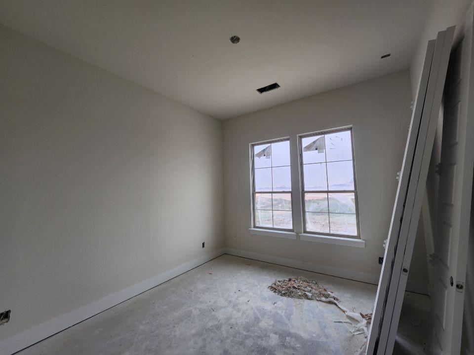2433 Meteor Drive Krum, TX 76249 - Photo 10 of 12 an empty room with windows
